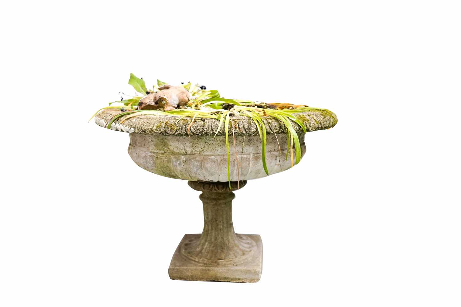 A stone composite garden urn