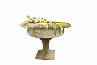 A stone composite garden urn