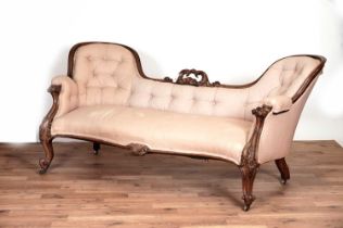 A Victorian carved rosewood serpentine 'show frame' sofa