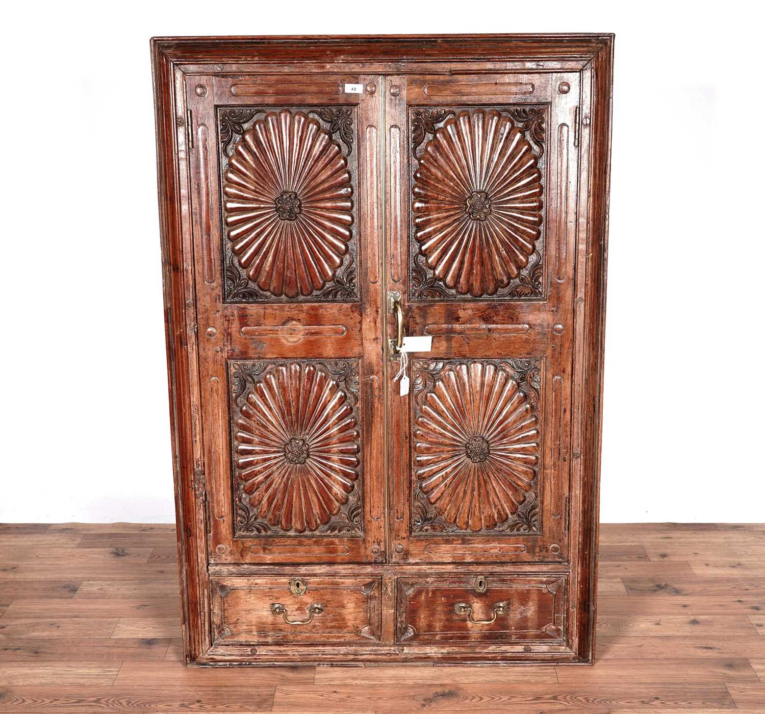 An Anglo-Indian style carved hardwood doored mirror