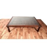 An Asian hardwood coffee table from Barker & Stonehouse