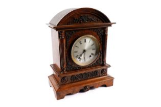 A Victorian eight-day oak mantel clock