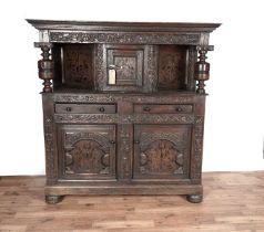 A substantial 17th Century style inlaid oak court cupboard