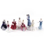 A collection of Royal Doulton ceramic figures of ladies