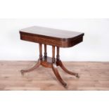 A Regency inlaid mahogany and rosewood crossbanded card table