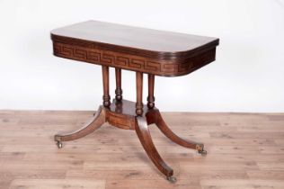 A Regency inlaid mahogany and rosewood crossbanded card table