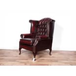 A 'Saxon' oxblood leather wingback armchair