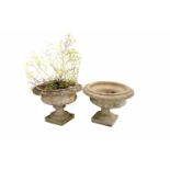 Two stone composite garden urns