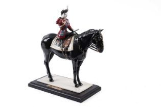 A Coalport Royal Commemorative 'Trooping the Colour' figure of Queen Elizabeth II