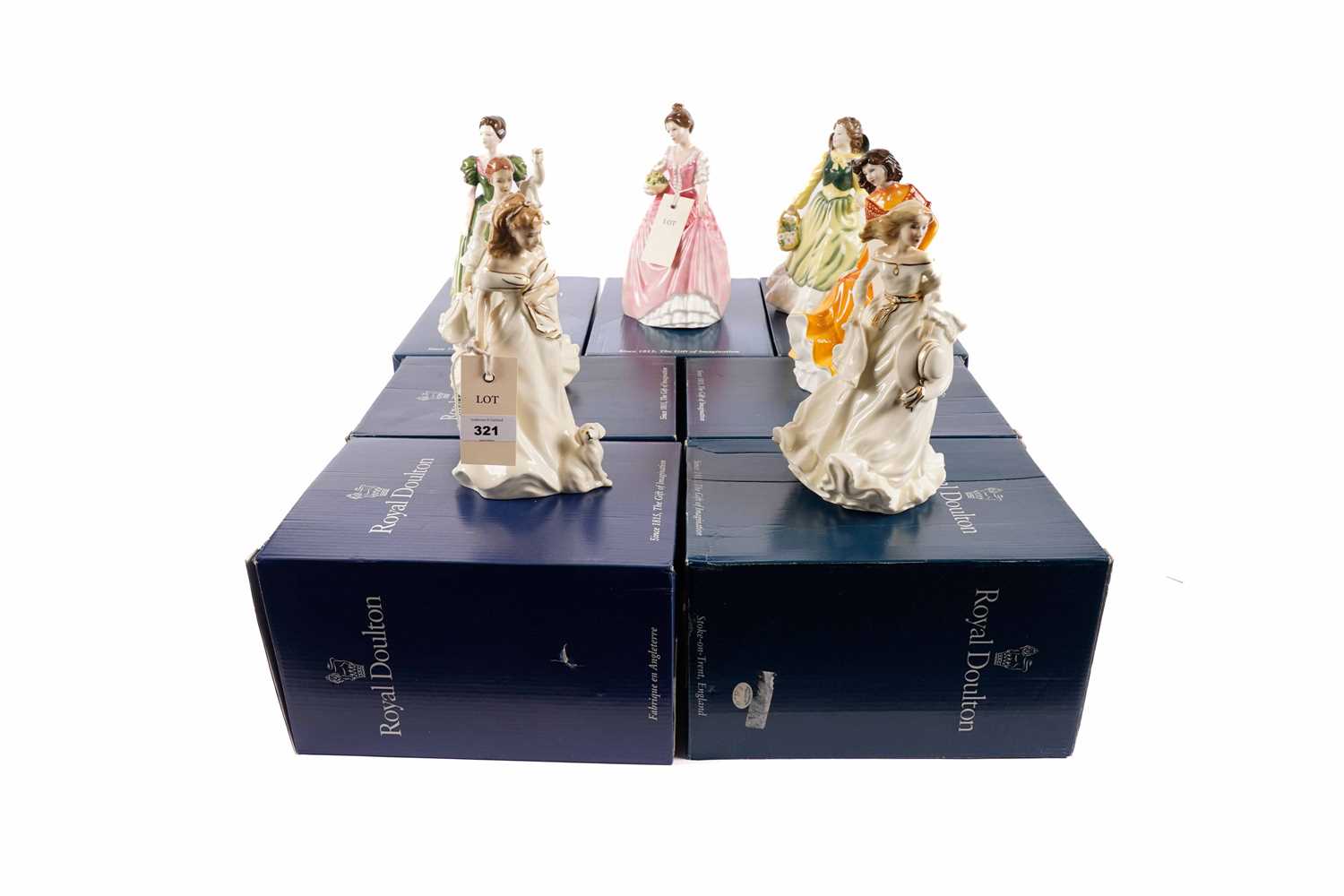 A collection of Royal Doulton decorative ceramic figures of ladies