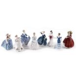 A collection of Royal Doulton ceramic figures of ladies