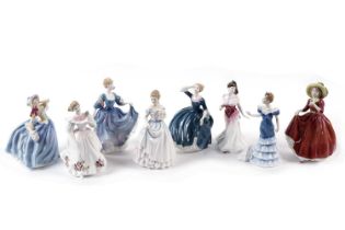 A collection of Royal Doulton ceramic figures of ladies