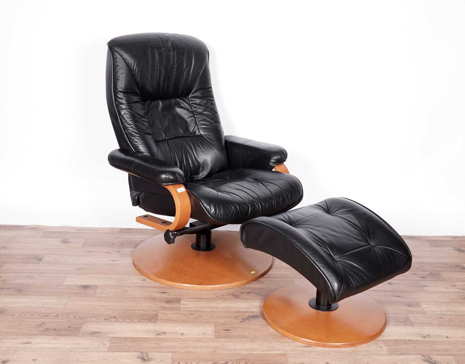 A black leather reclining armchair and stool by ChairWorks - Image 4 of 5