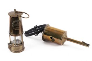 A miner's lamp; and , a brass meat jack