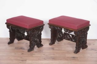 Two decorative Victorian carved oak stools,