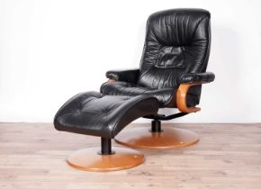 A black leather reclining armchair and stool by ChairWorks