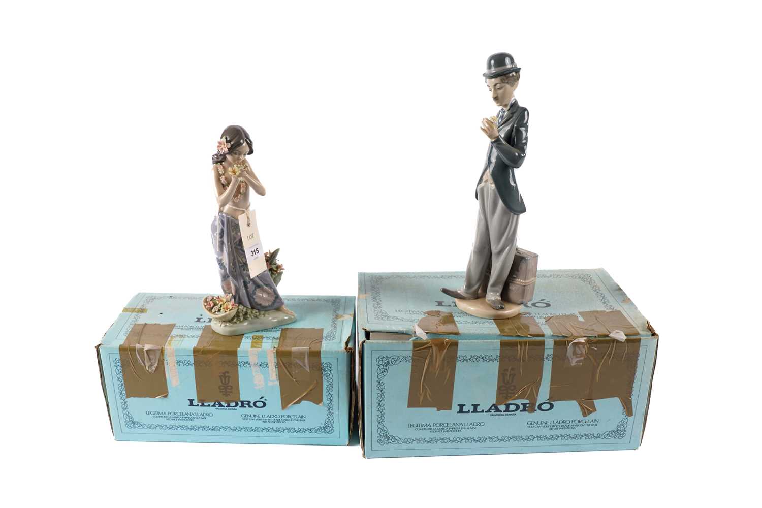 A Lladro figure of Charlie Chaplin; and a Lladro figure of a Hawaiian girl