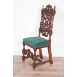 A decorative late Victorian carved oak hall chair