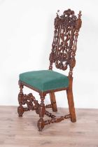 A decorative late Victorian carved oak hall chair
