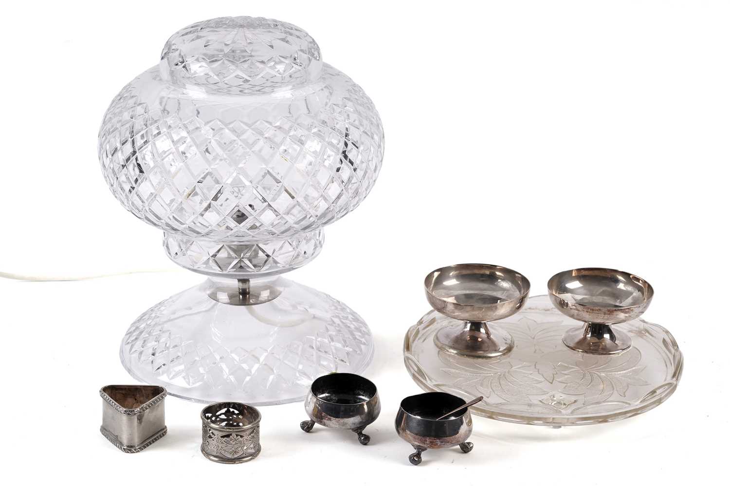 A 20th Century cut-glass lamp and a selection of early 20th Century and later silver-plated ware