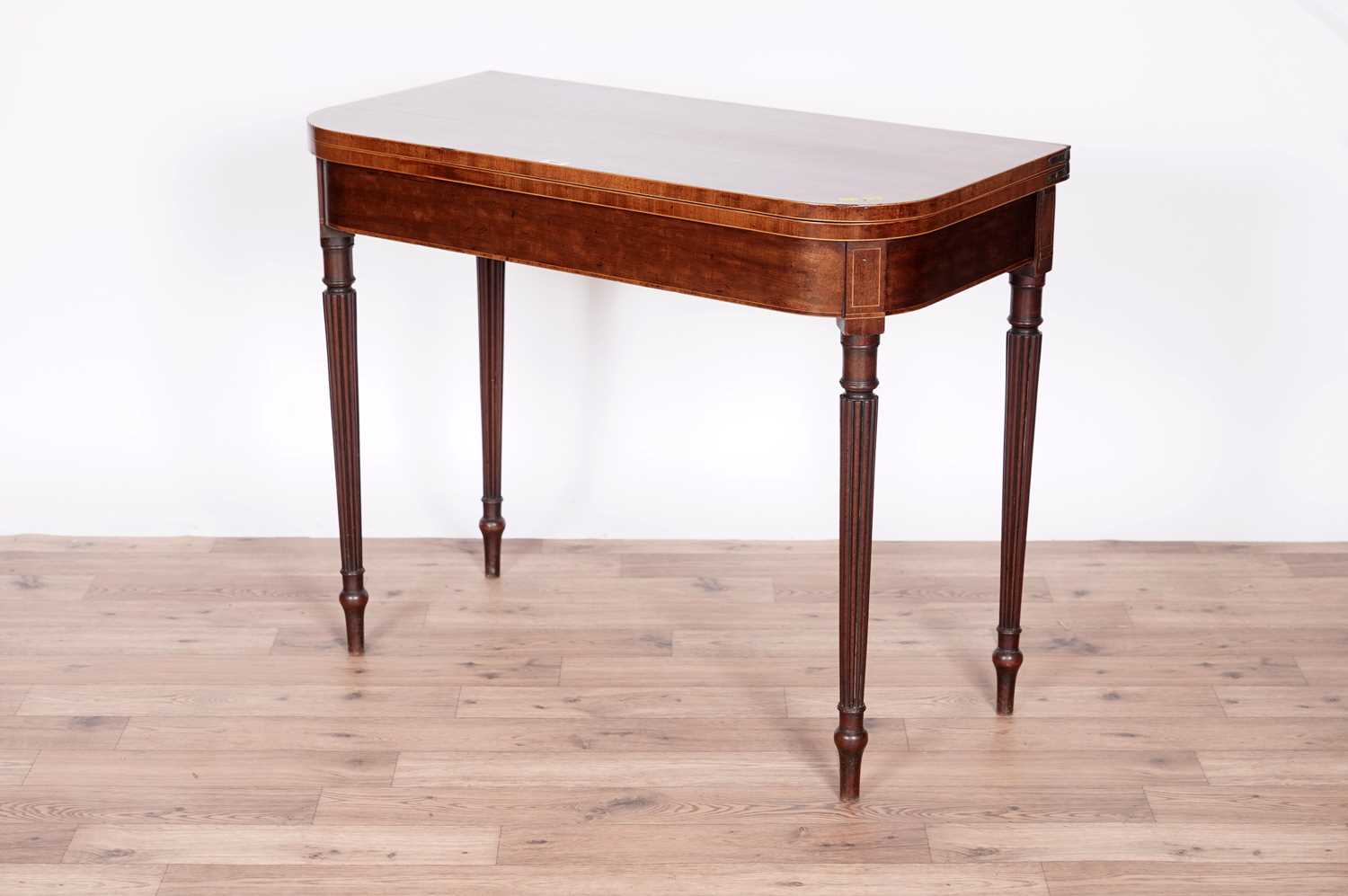 A George III 'fiddle back' mahogany card table