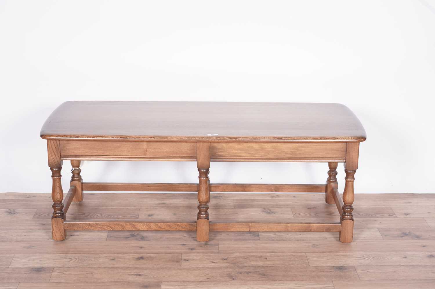 An Ercol elm coffee table - Image 2 of 16