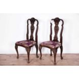 A pair of decorative mid 18th century style carved and stained beech side chairs