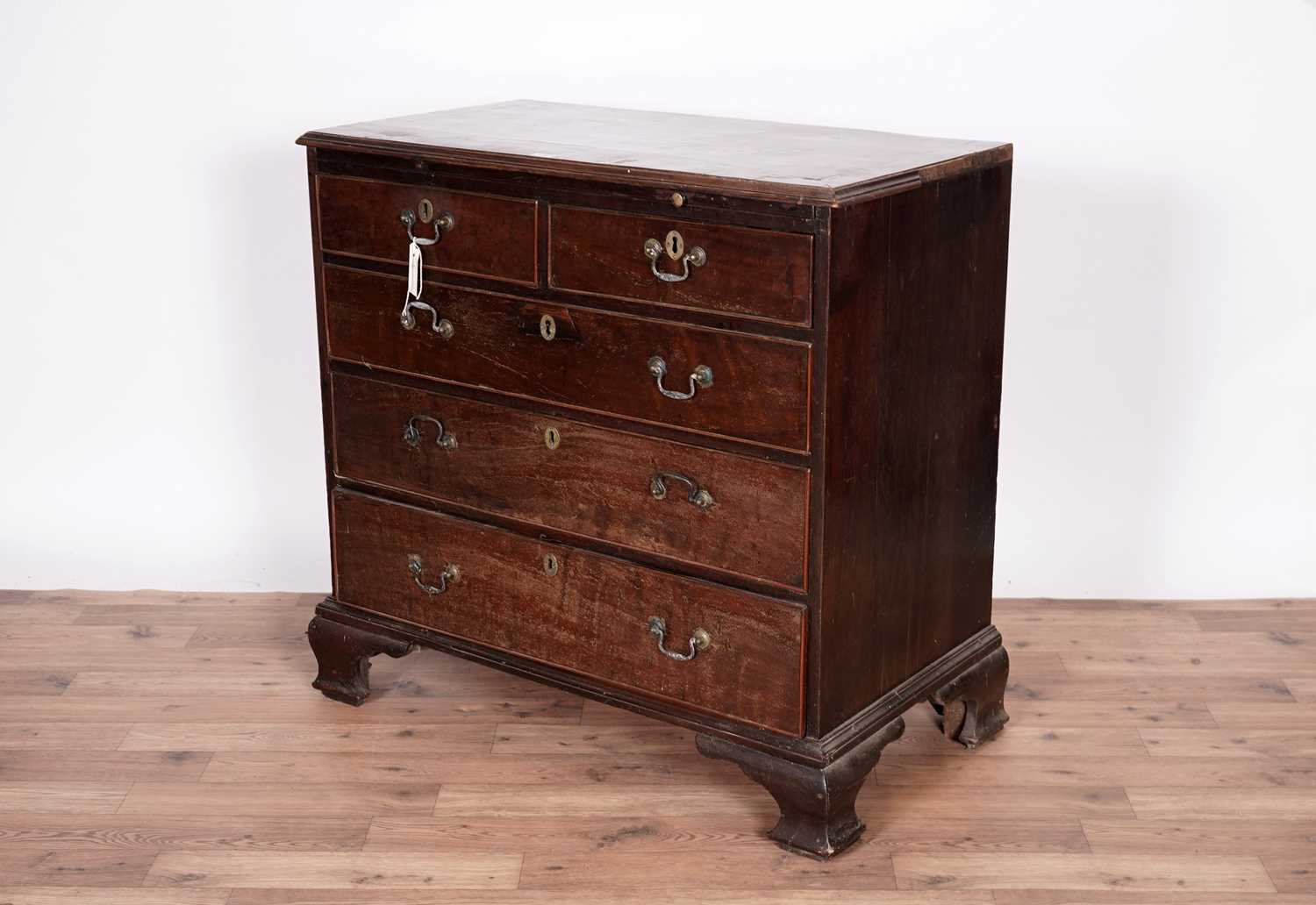 A Georgian inlaid mahogany bachelor's chest of drawers