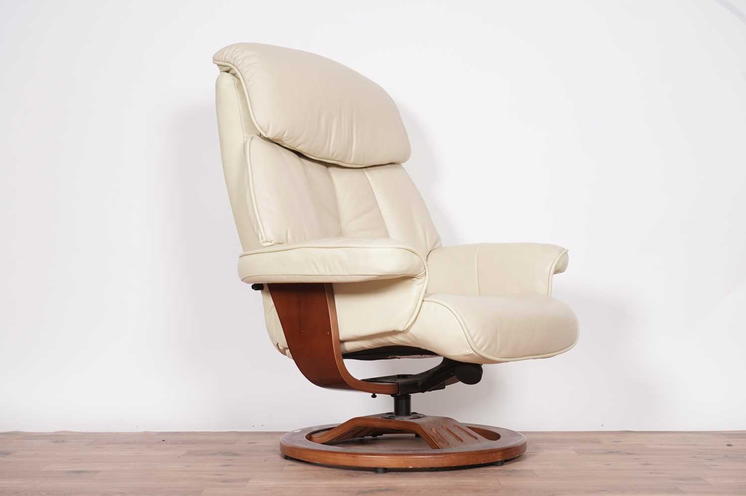 A leather reclining armchair with matching footstool by Global Furniture Alliance - Image 3 of 3