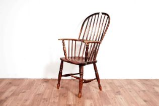 A 19th Century beech and elm comb back Windsor chair