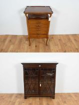 An early 20th Century mahogany music cabinet and a mahogany bookcase