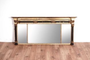 A 19th Century gilt and ebonised overmantel mirror, with Lloyd label