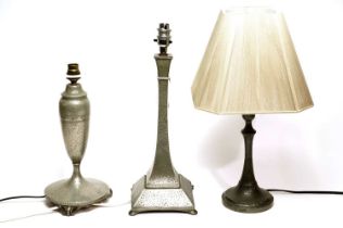 Three pewter table lamps