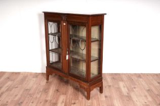 An Edwardian inlaid mahogany china display cabinet