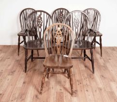 A set of six beech and elm wheelback windsor chairs