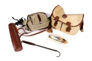 A selection of fishing reels, bags and accessories