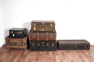 A collection of six vintage trunks