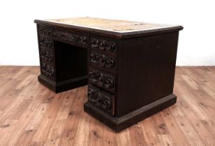 A Victorian oak pedestal desk