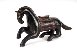 A Chinese lacquered carved wood figure of a horse