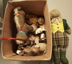 A selection of vintage teddy bears and toys