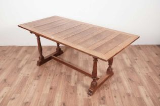 A 1920s oak panelled refectory table