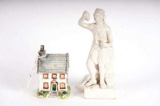 A Leeds Pottery ceramic figure of a cottage; a Leeds Pottery figure of Bacchus