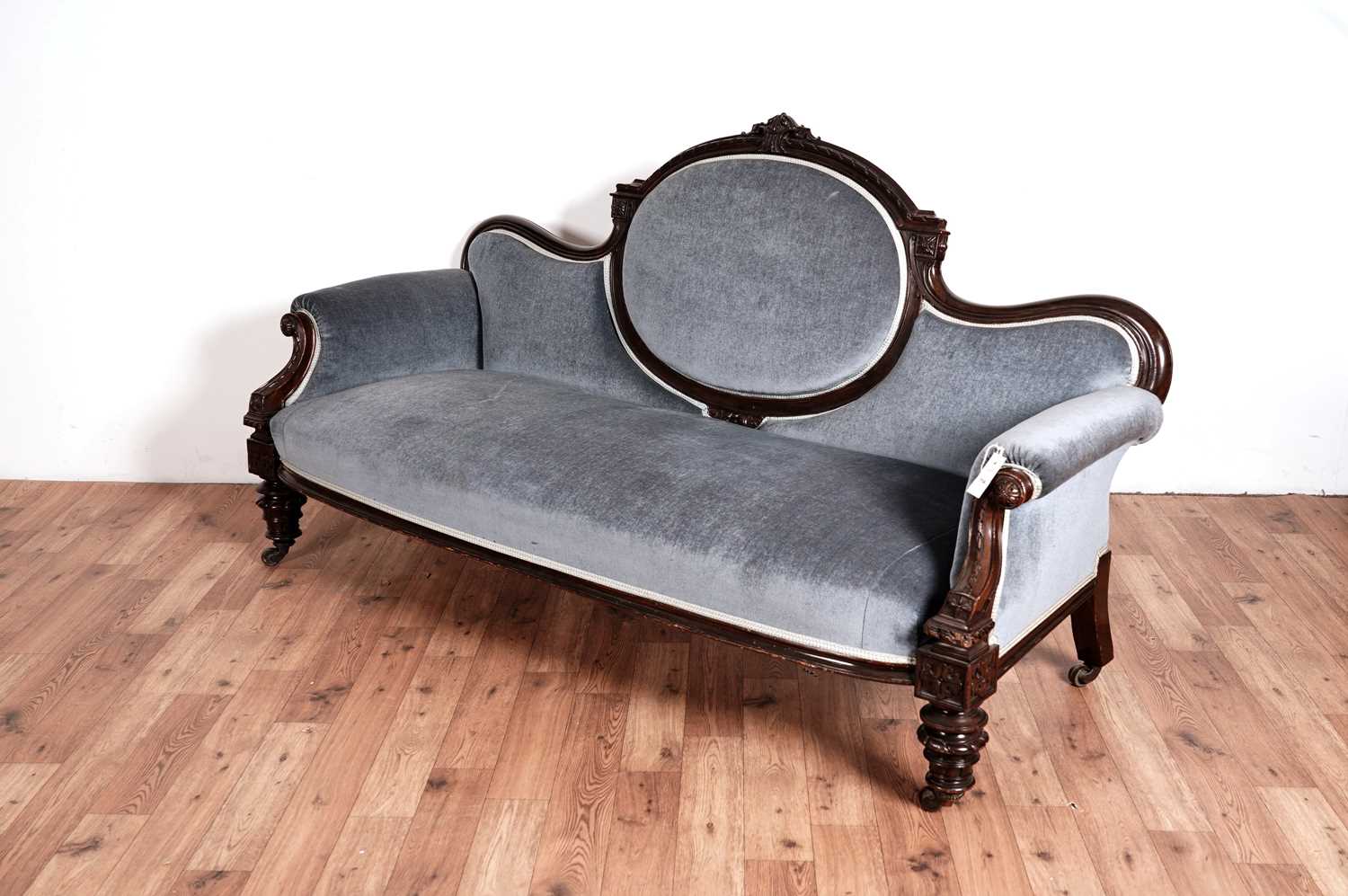 A Victorian carved mahogany 'showframe' sofa