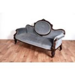 A Victorian carved mahogany 'showframe' sofa
