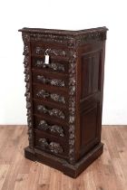 A Victorian carved oak wellington chest.