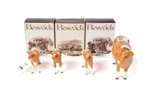 A Beswick Cow and three calves