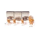 A Beswick Cow and three calves