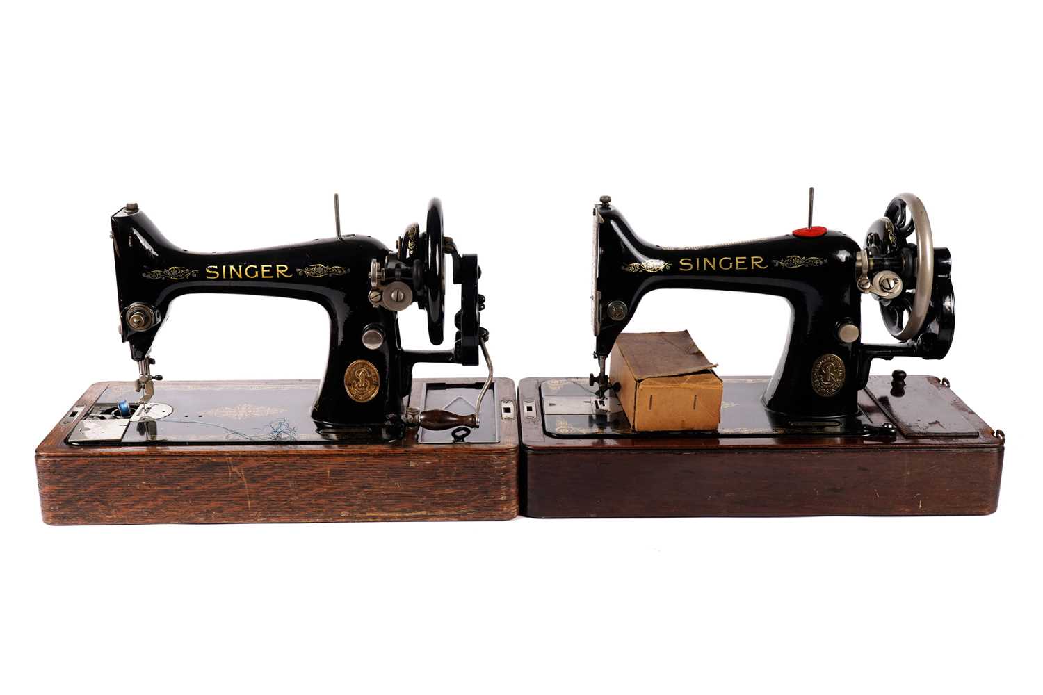 Two portable Singer sewing machines