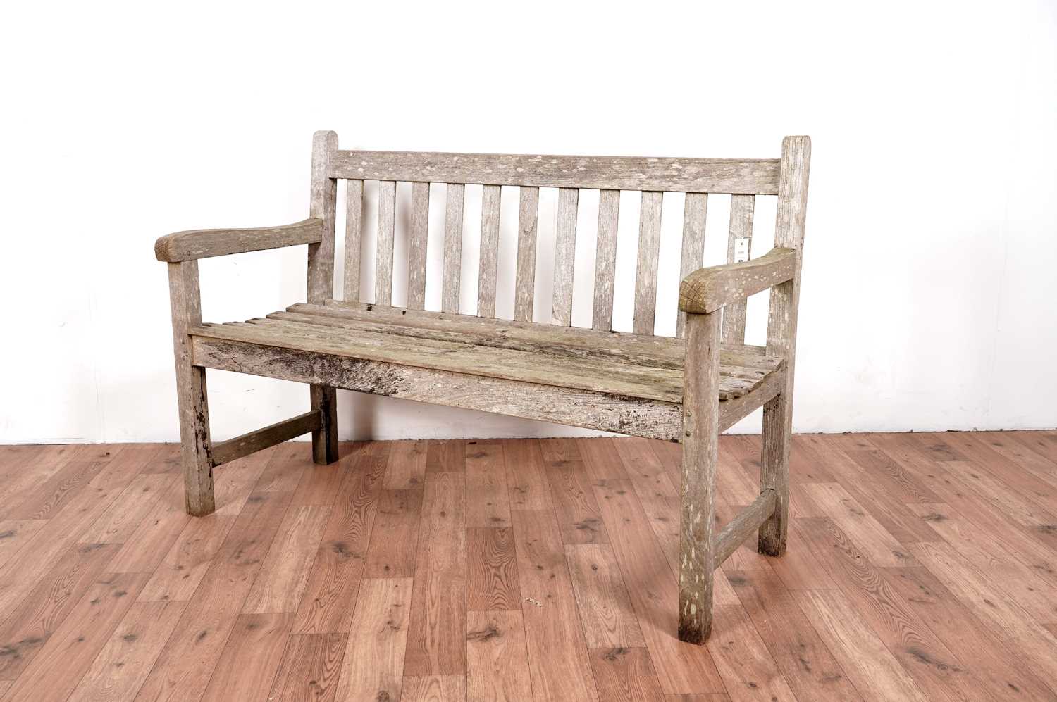 A modern teak garden bench