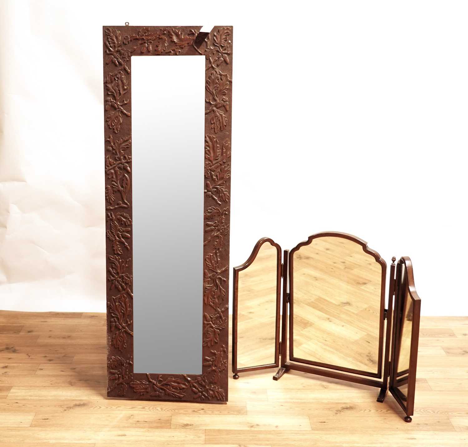 Carved oak wall mirror and a toilet mirror